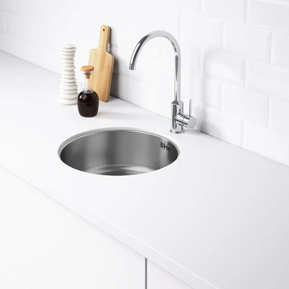Stainless steel kitchen sink with two pre-drilled holes for tap installation, featuring a modern, sleek design.