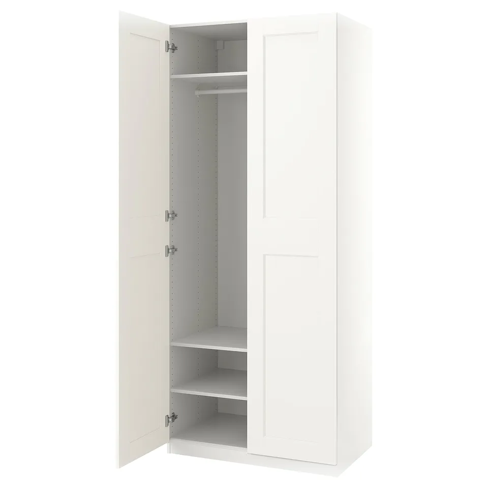 White PAX wardrobe, slim & narrow, open doors revealing shelves & rail, sleek minimalist design.