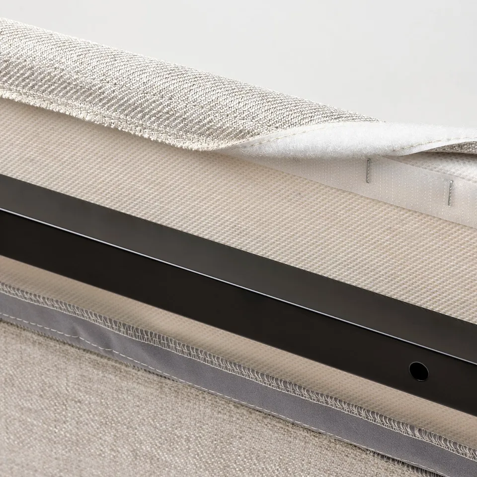 Close-up of RAMNEFJÄLL bed cover; machine washable, easy to remove and put back on.