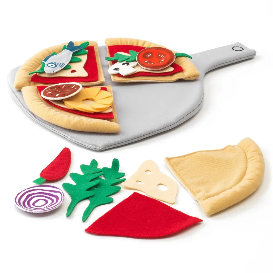 A plush pizza play set featuring toppings, including slices and a pizza shovel, for imaginative play and role practise.