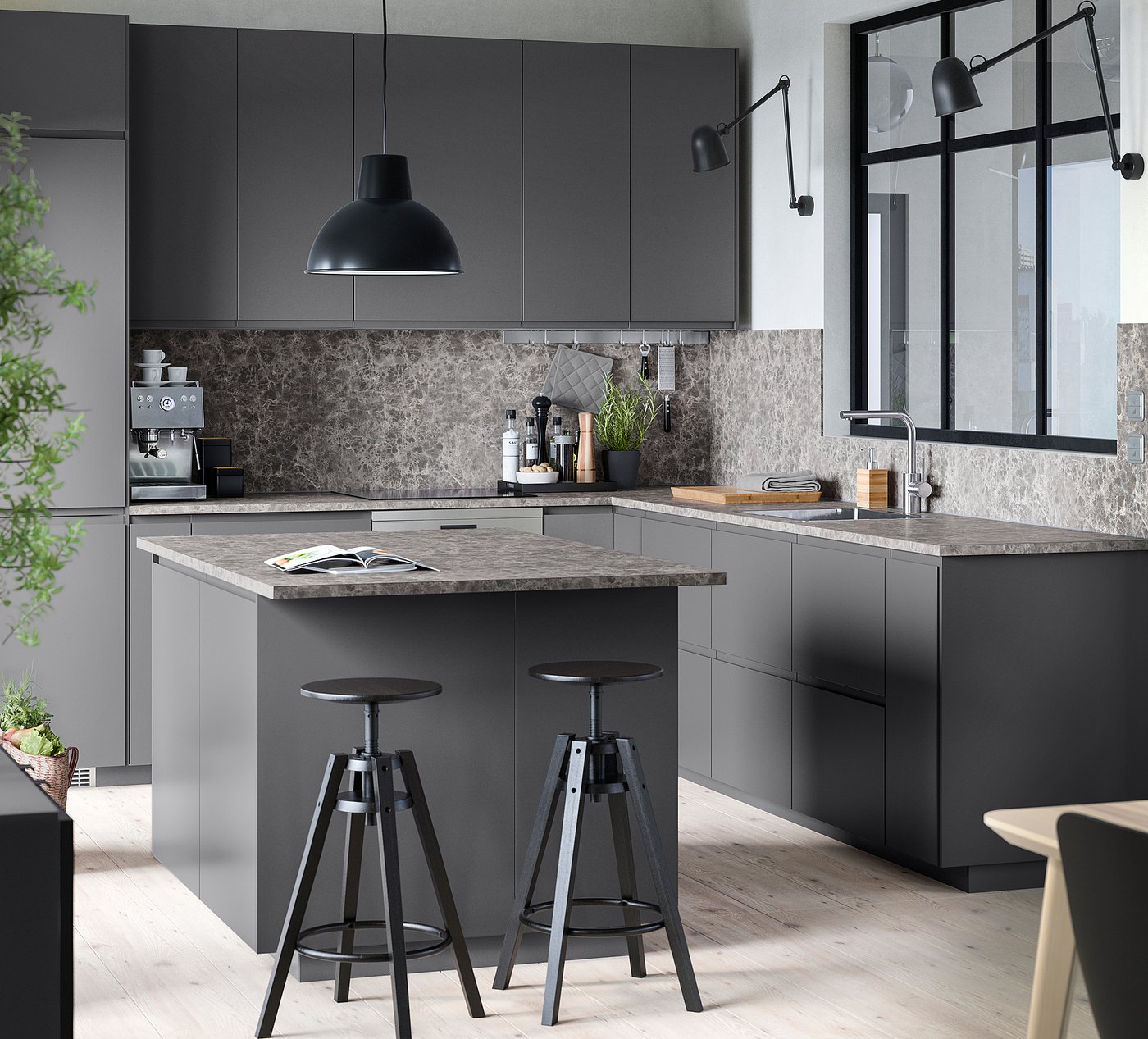 Modern grey kitchen with island, two bar stools, pendant lamp, and integrated appliances, featuring sleek design and handleless cabinets.