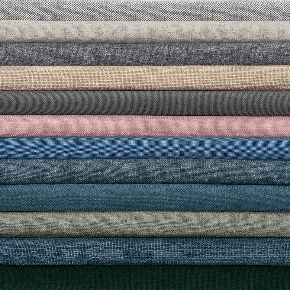 Stacked KIVIK sofa covers in various colours and shades, neatly folded, showcasing textured corduroy material.