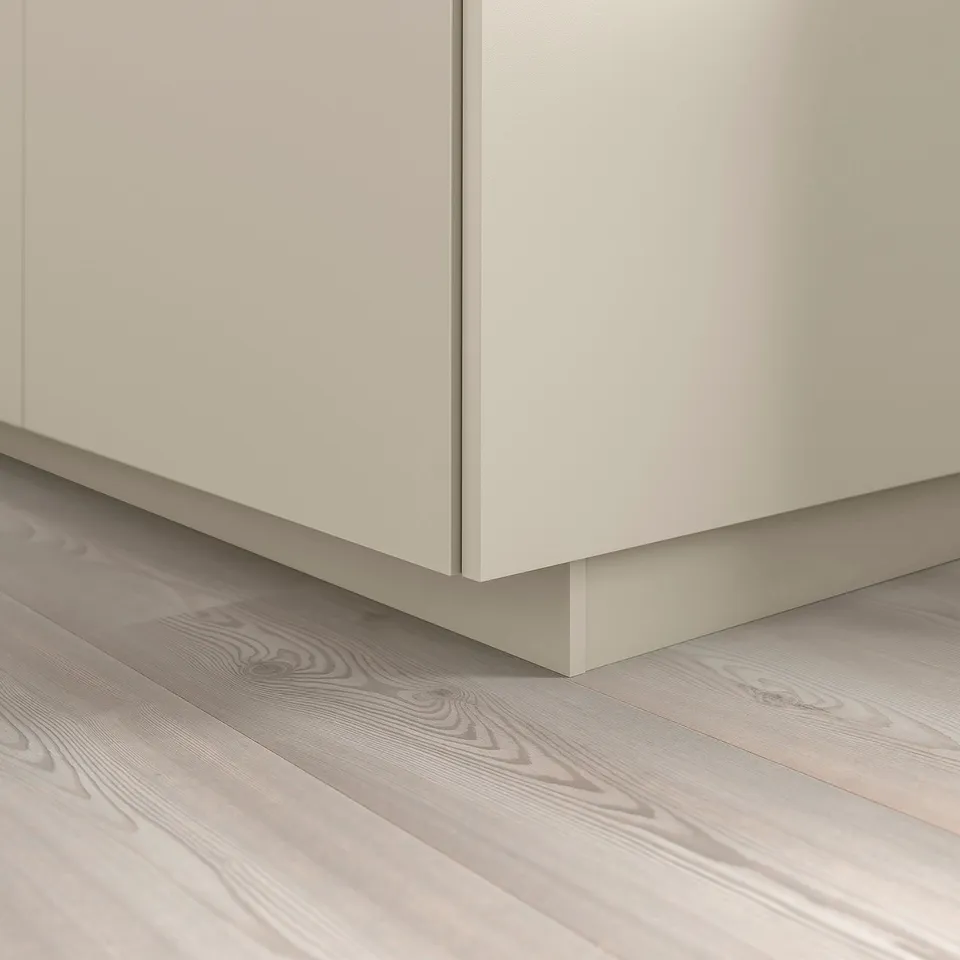 Beige HAVSTORP kitchen plinth covers floor gap, part of metod series.