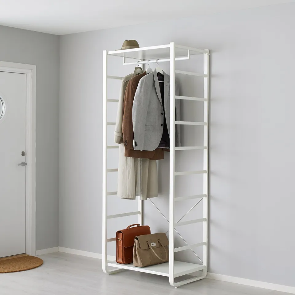 White metal storage rack with adjustable shelves and clothes rail holding jackets, hats, and bags.