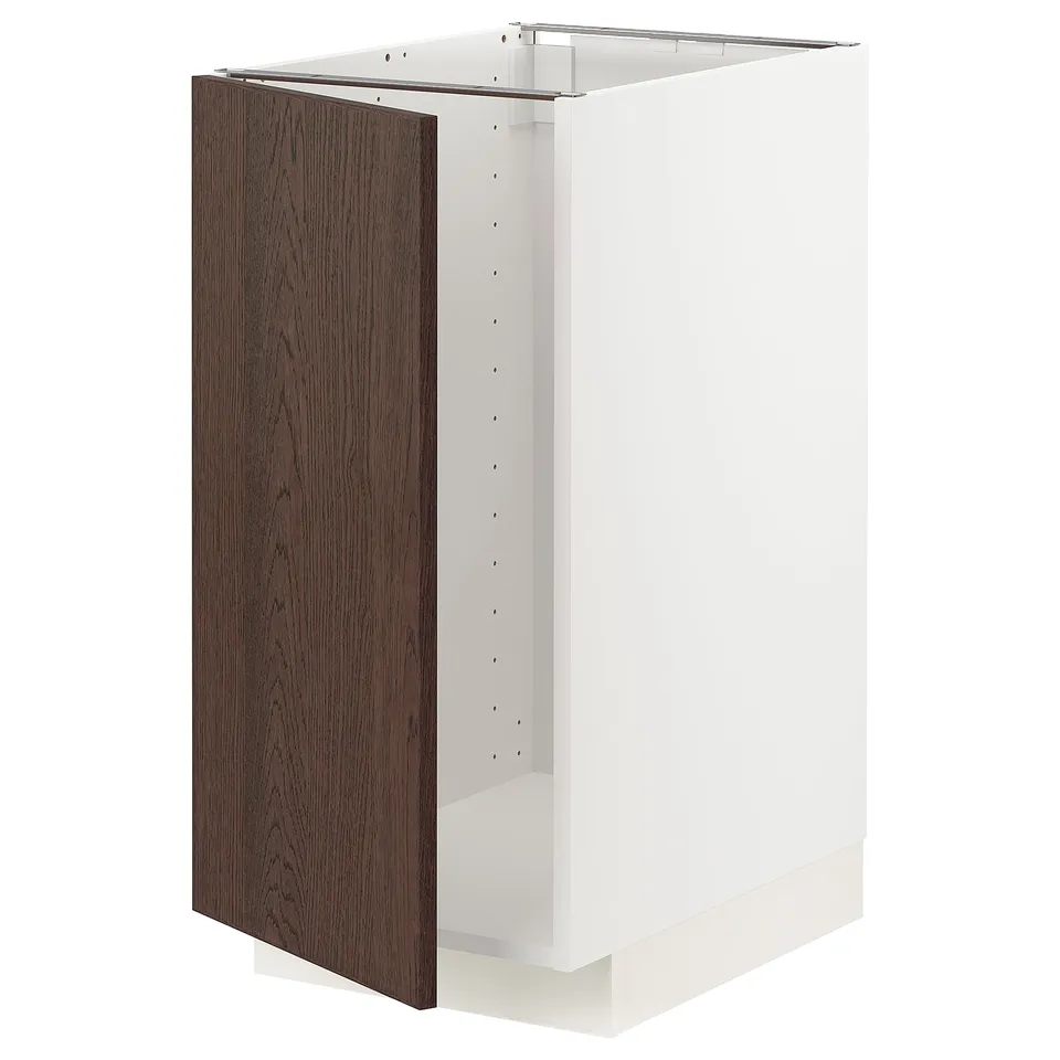 A METOD kitchen cabinet in white with a dark brown wooden door. It stands upright with a boxy design.