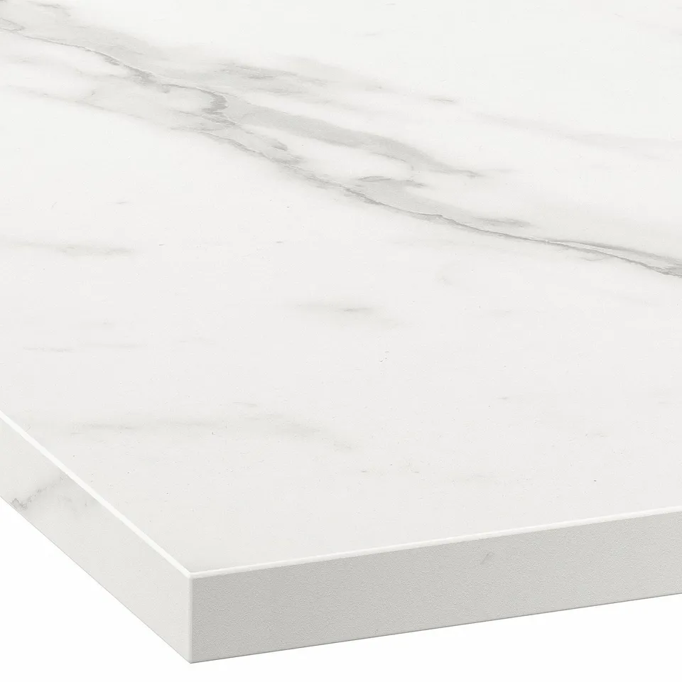 Close-up of sleek, smooth, white EKBACKEN laminate countertop with subtle veining and straight edge.