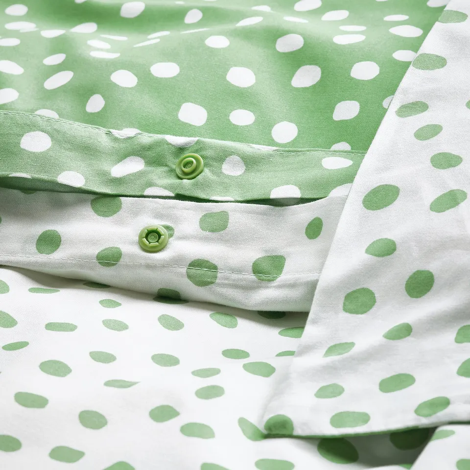 Green polka dot duvet cover set with snap closure, soft cotton/viscose blend shown.
