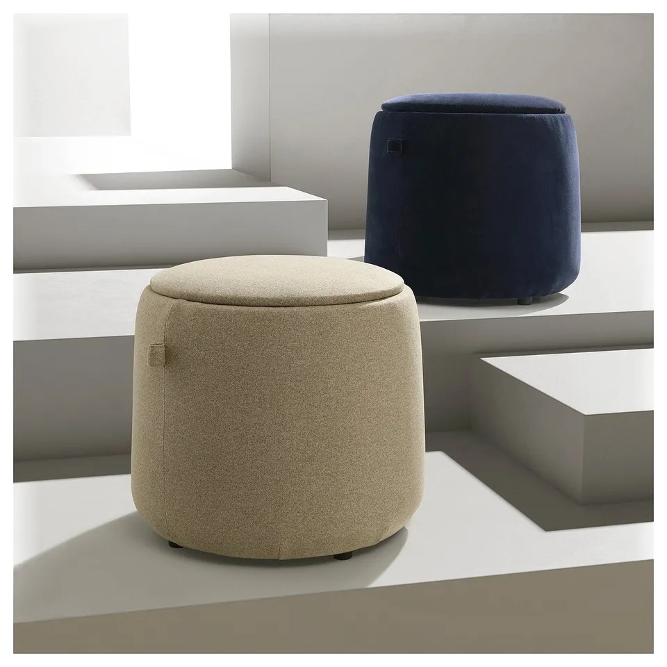 JÄRRESTAD pouffes in beige and dark blue, featuring a soft, rounded shape and padded seats, placed on a minimalist white background.