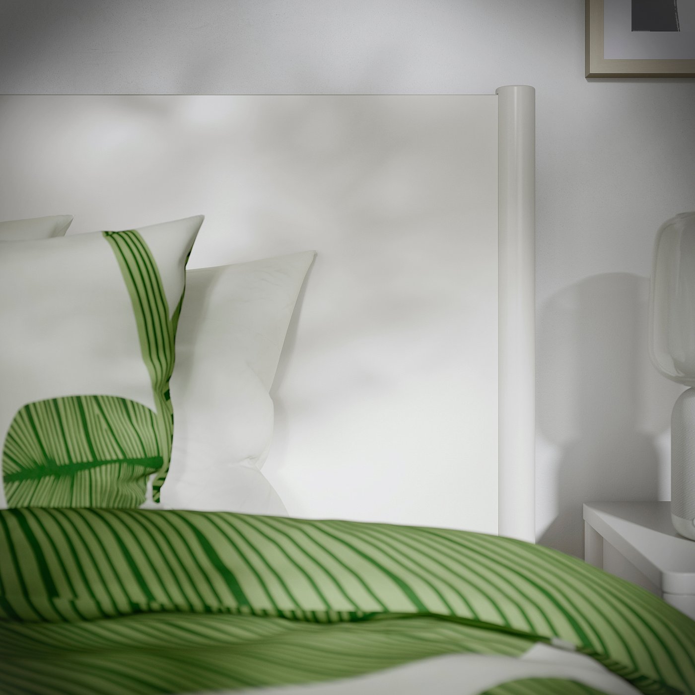 A well-crafted bed with off-white finish, soft-closing drawers, and slatted base.