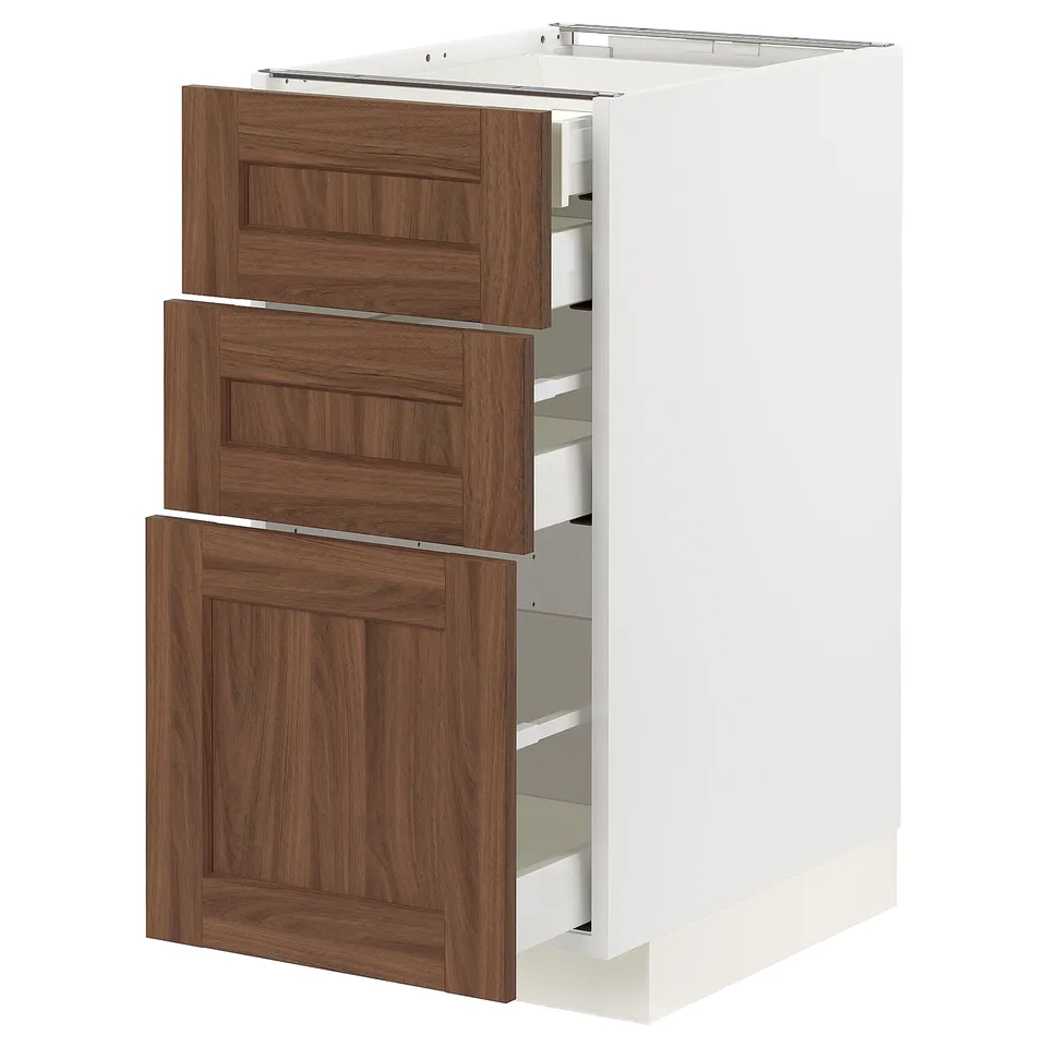 Modern kitchen cabinet in white with walnut drawers, three drawers, sleek design.
