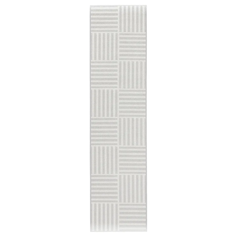 Grey and white striped GATUSEKTION kitchen mat with chequered design.
