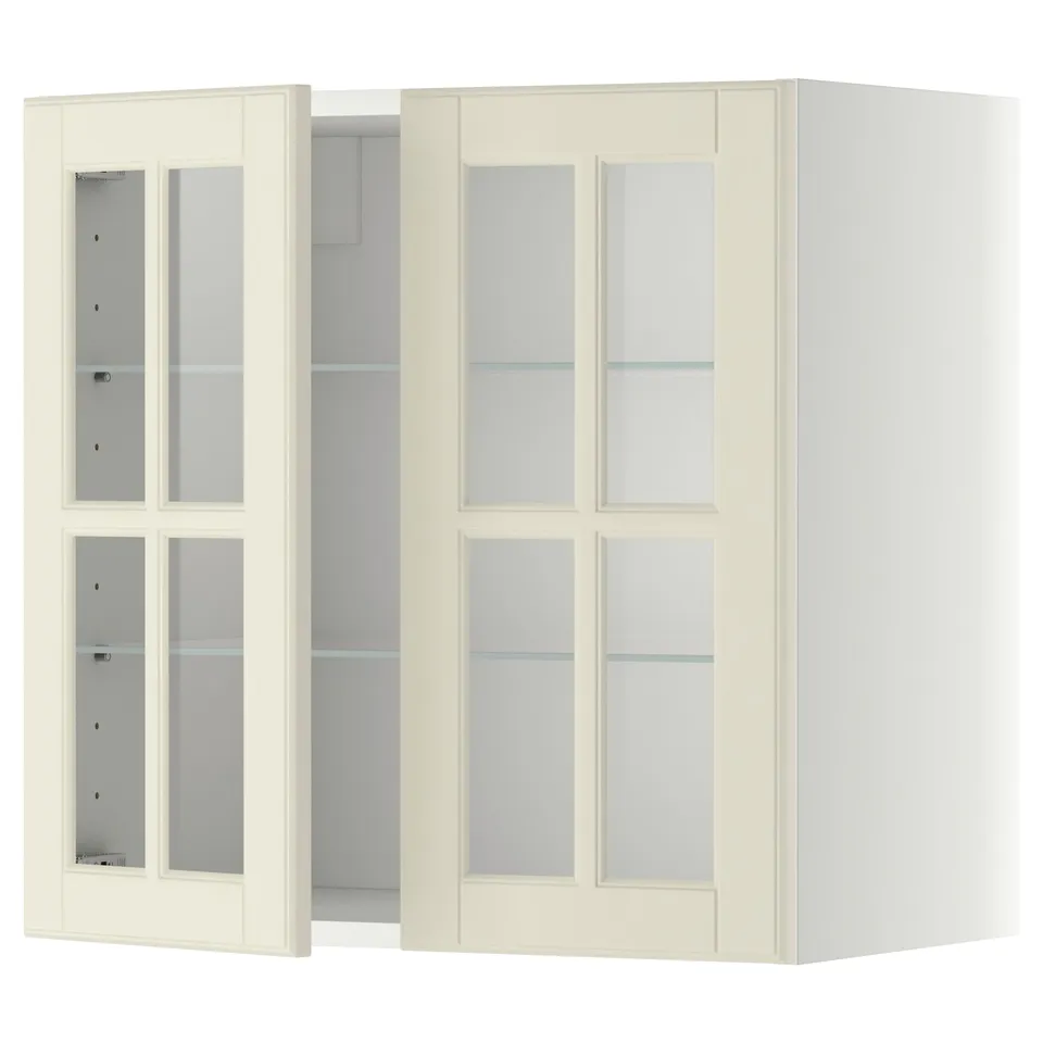 A white METOD kitchen cabinet with frosted glass doors and adjustable shelves.