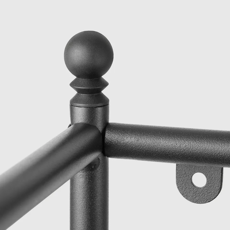 Metal shelf detail, round finial top, strong welds, textured black paint.