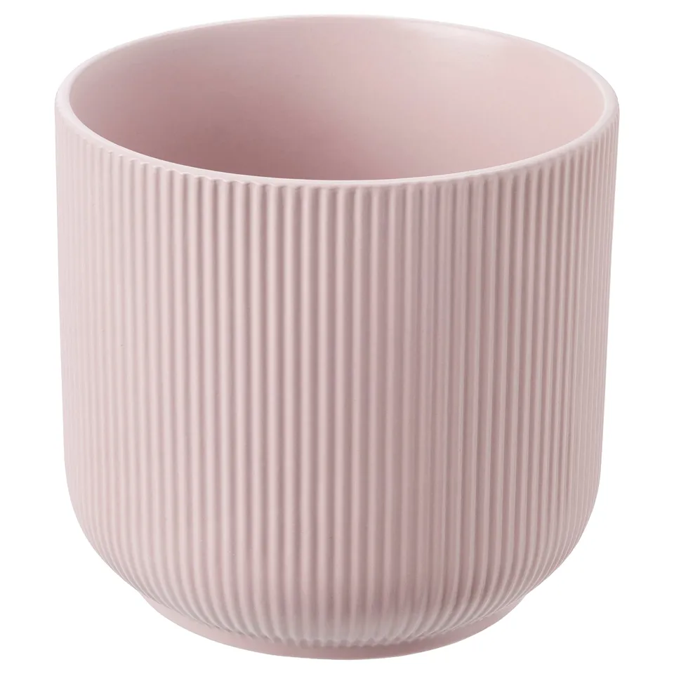Light pink GRADVIS planter, cylindrical shape with vertical grooves, made of stoneware.