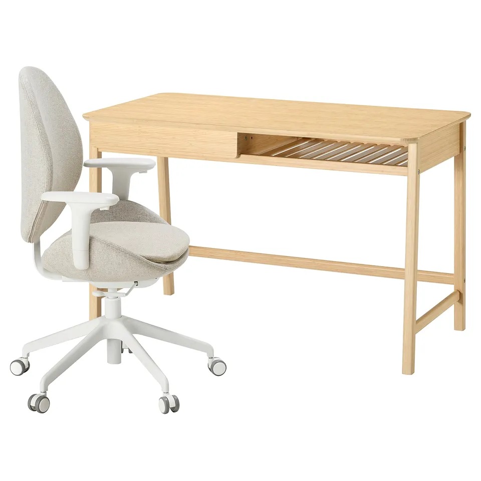 Light-colored desk, natural wood finish, and matching ergonomic chair with light fabric.