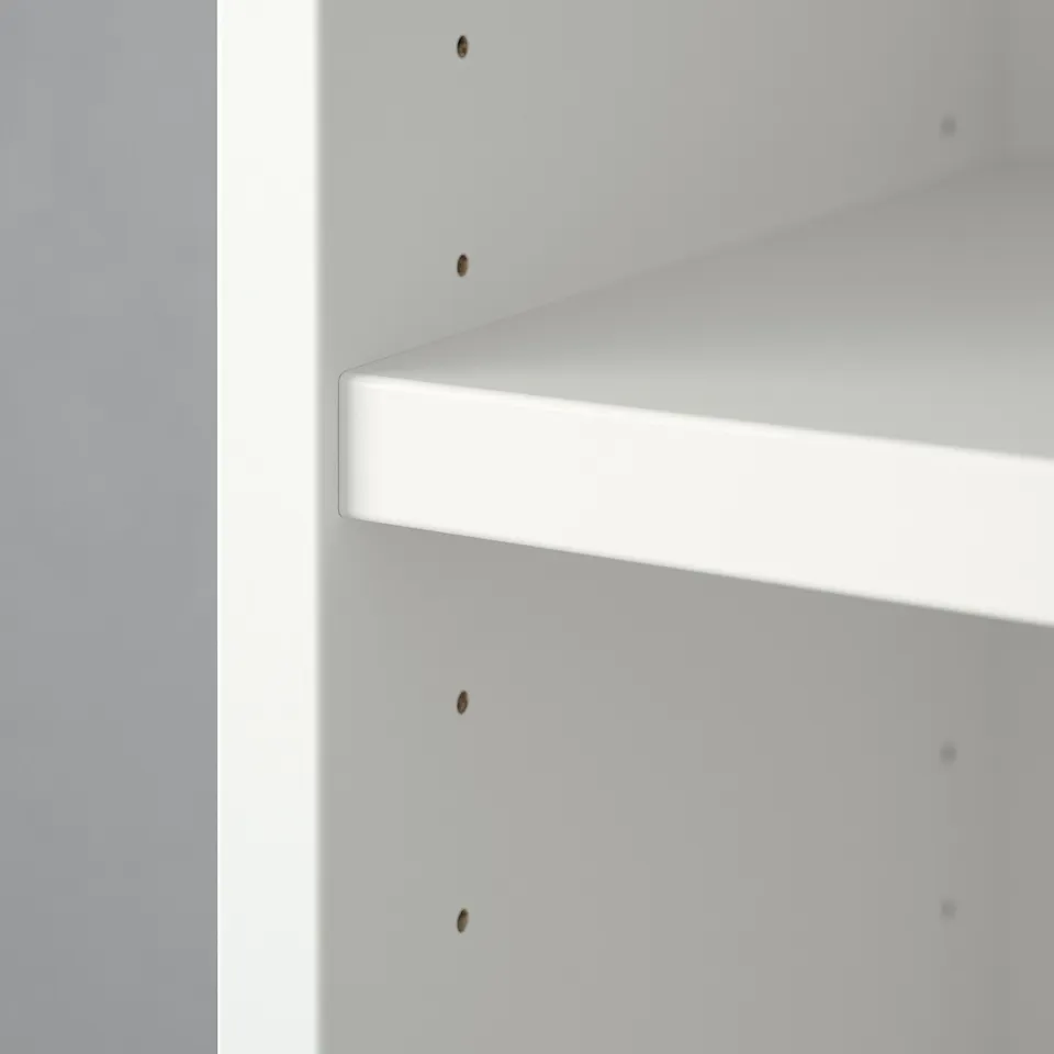 White BILLY bookcase shelf. Minimalist design, clean lines, shallow shelf, adjustable, versatile storage.