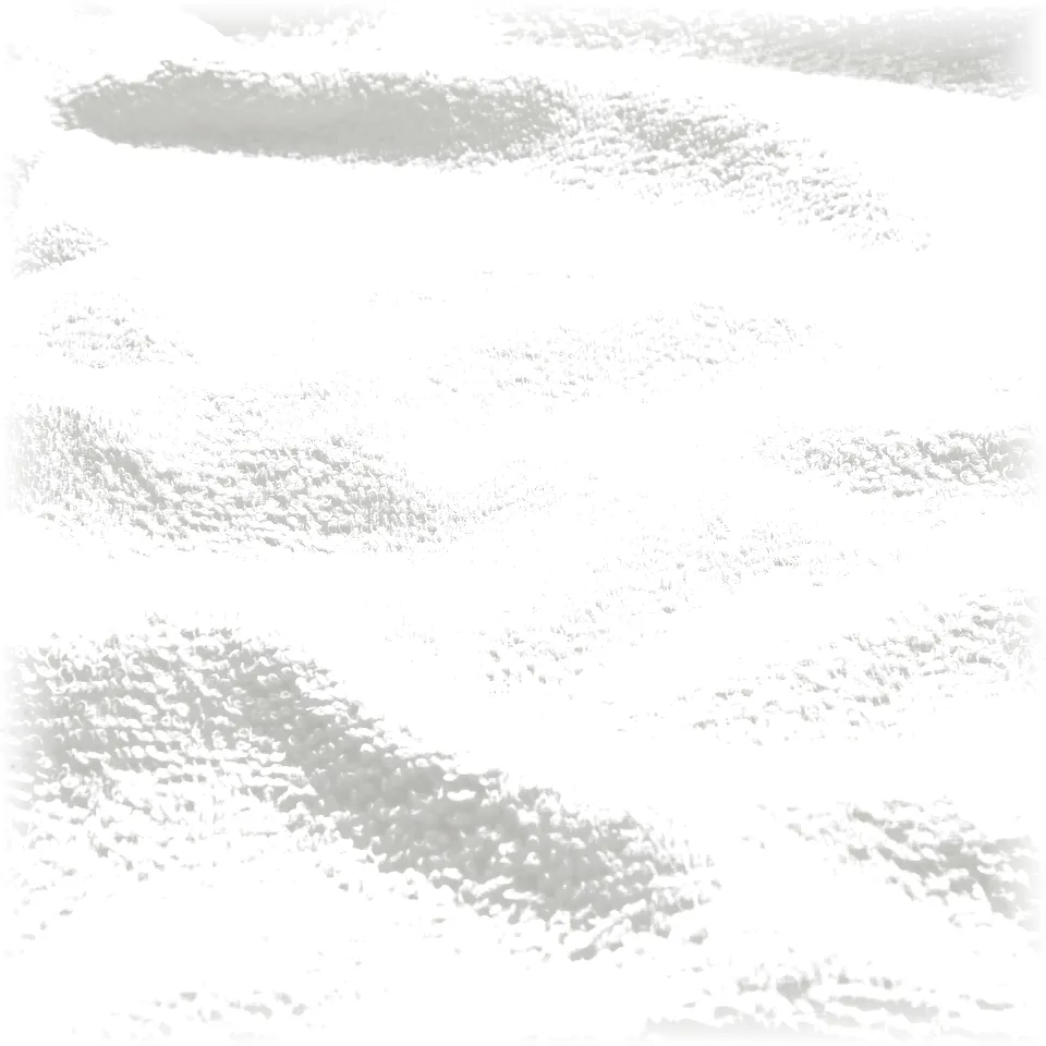 Close-up of soft, white, textured cotton towel. Visible weave pattern, smooth and plush feel.