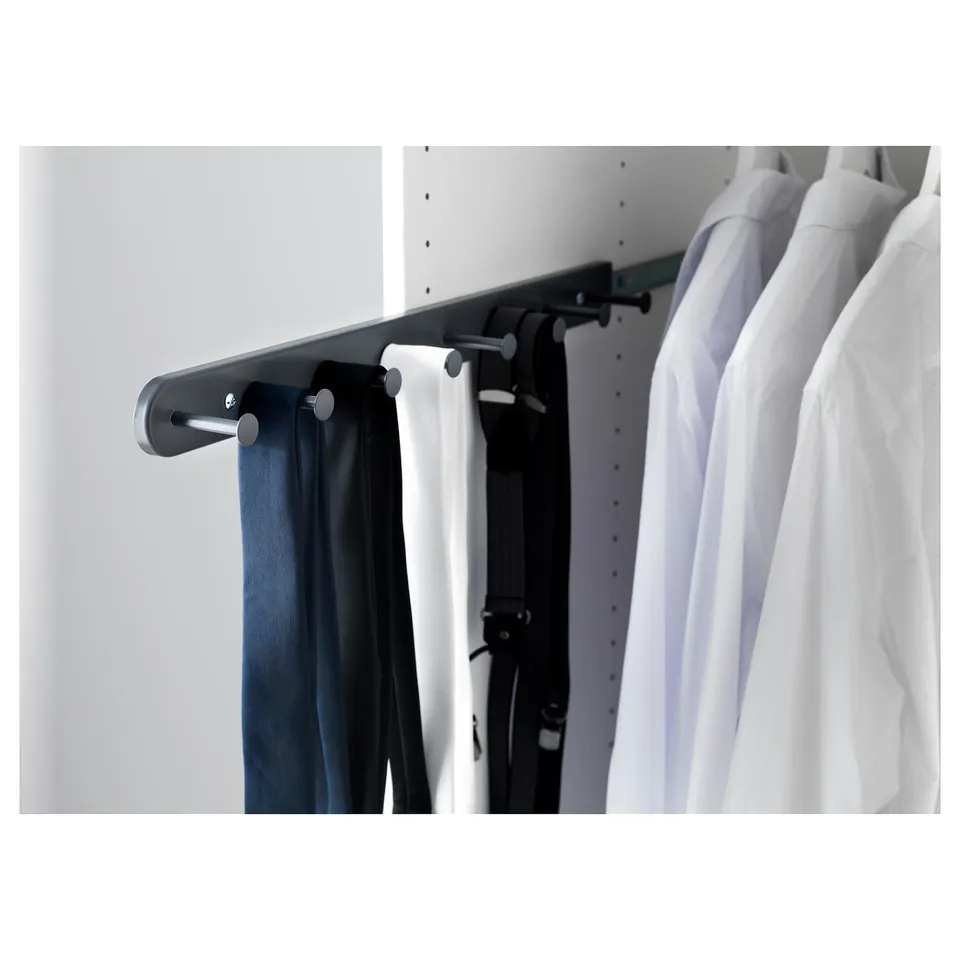 KOMPLEMENT wardrobe organiser with grey metal hangers holding white shirt and dark trousers.