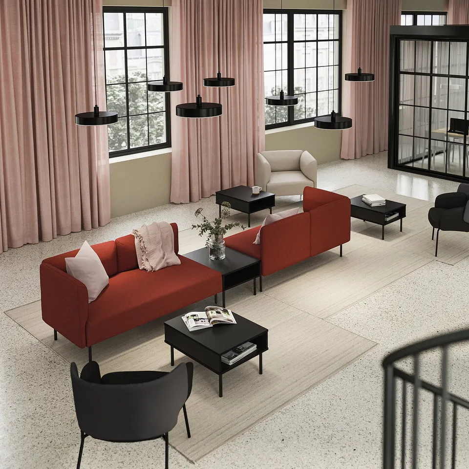 Modern living room with red & beige LILLEHEM sofas, black coffee tables, pink curtains, and black pendant lights.