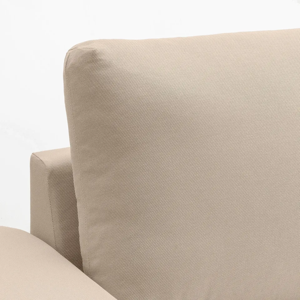 Modern beige sofa with plush, removable cushions.