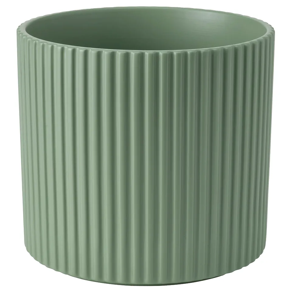 Green DAKSJUS pottery planter, cylindrical with ribbed design, earthenware material.
