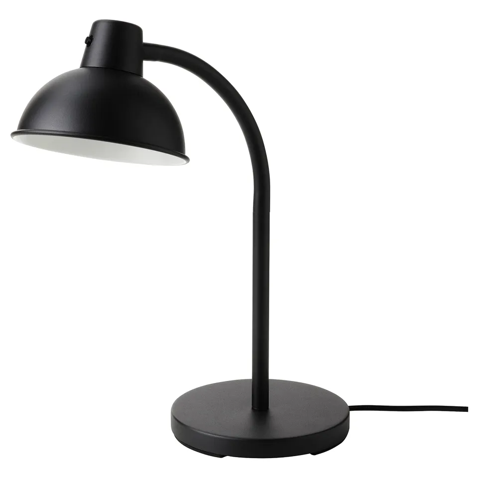 Black SKURUP table lamp with adjustable dome-shaped shade. Modern, minimalist design with round base.