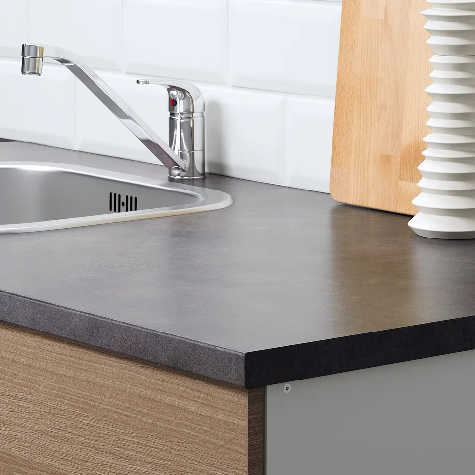Modern kitchen countertop with sink and tap, part of the KNOXHULT series, designed for easy cleaning and heat resistance.