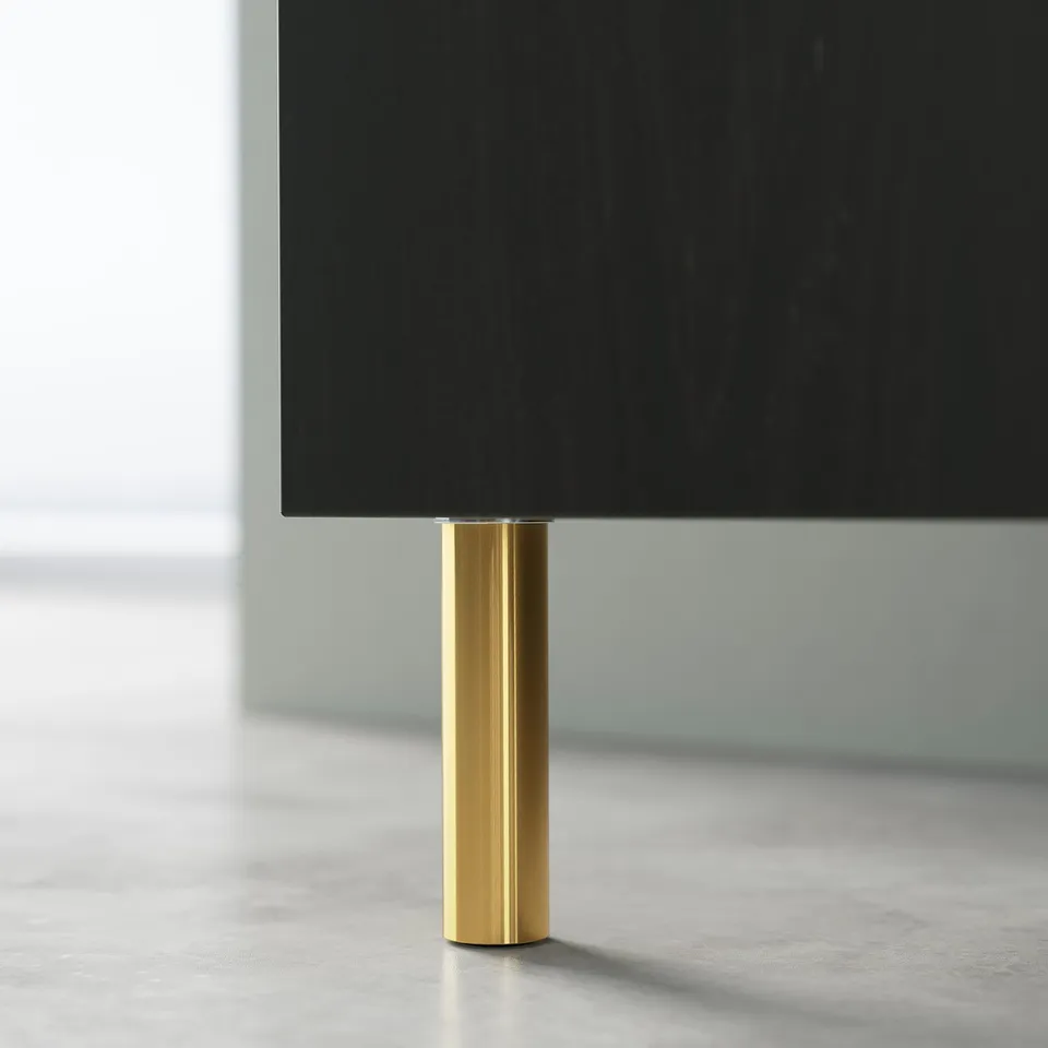 A sleek black tv stand with shiny gold legs, elegant and modern design, ideal for cable management.