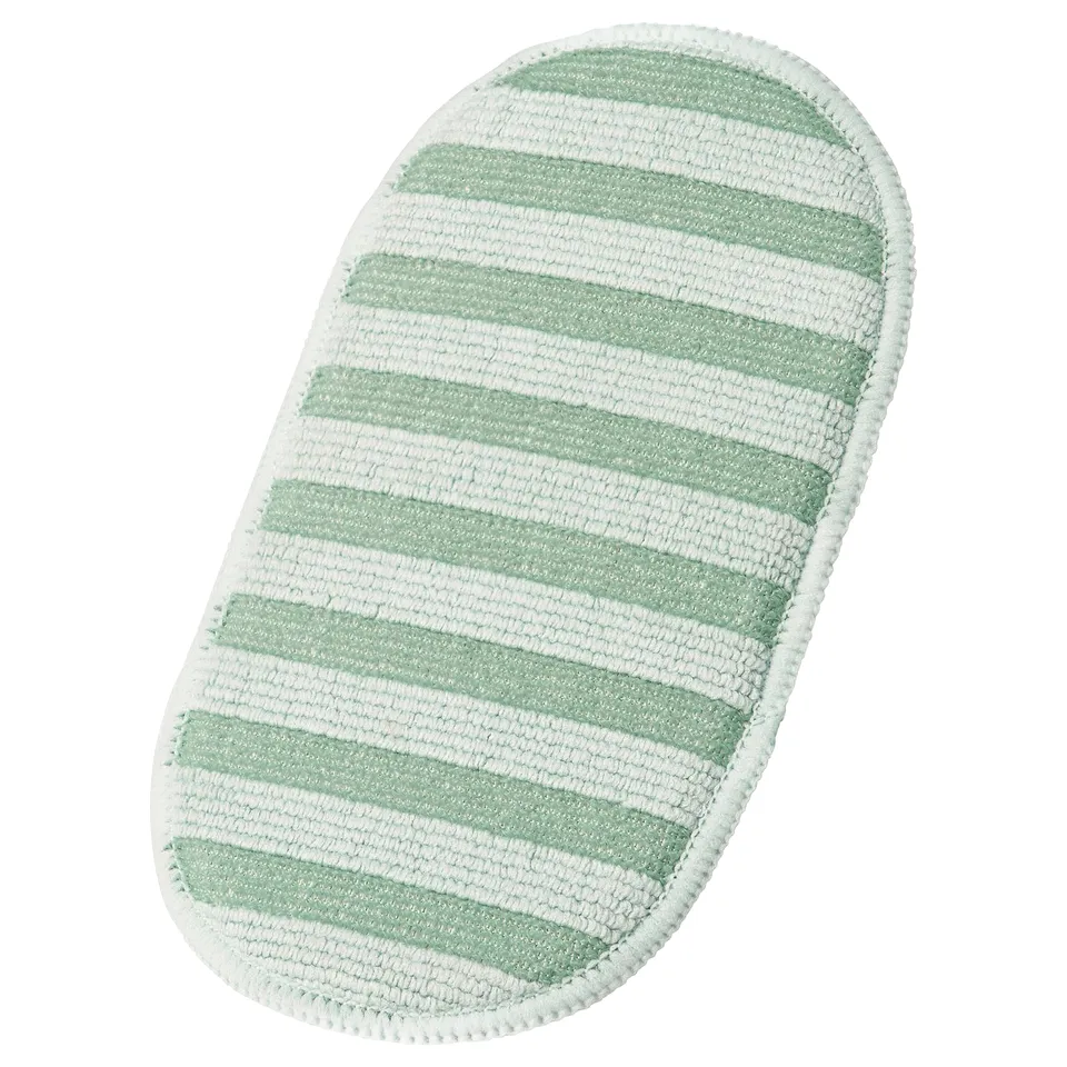 A green and white striped PEPPRIG microfiber pad for cleaning. Oval-shaped, recycled materials.