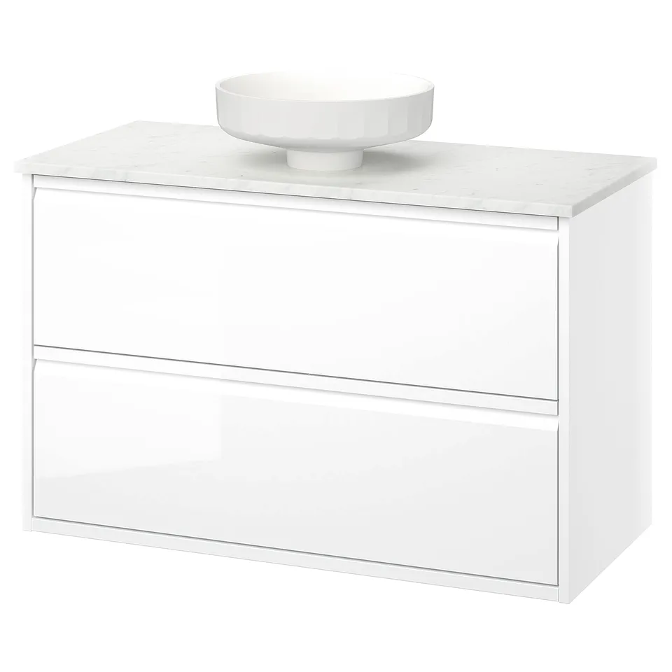 Modern white bathroom cabinet with marble countertop and round basin.