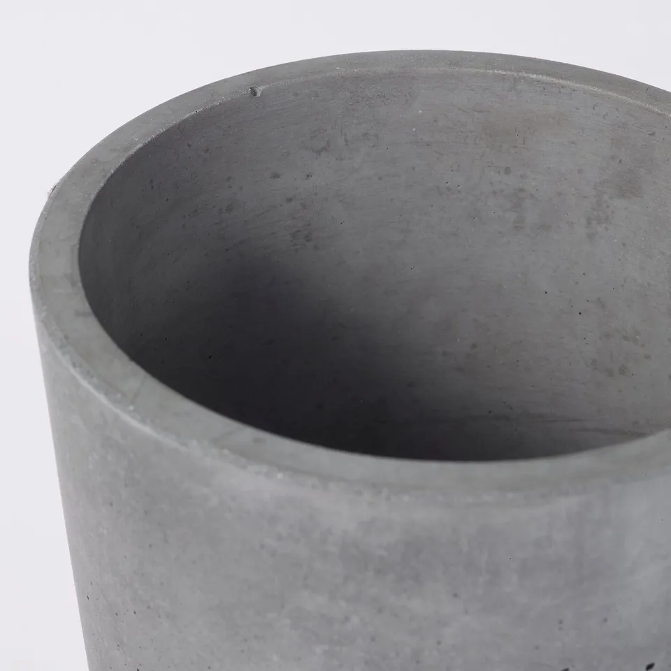 Large round planter with smooth finish, showing slight variations & air bubbles in grey concrete.
