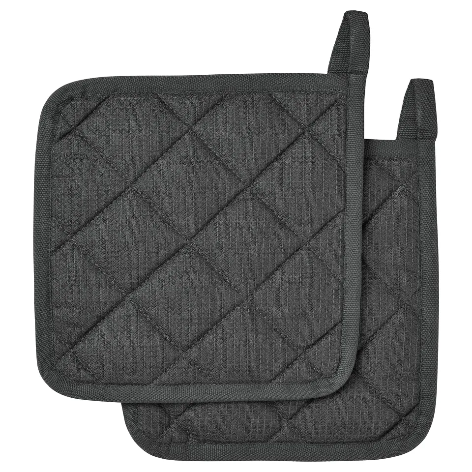 Black cotton potholders with recycled polyester lining. Square shape, diamond stitching design.