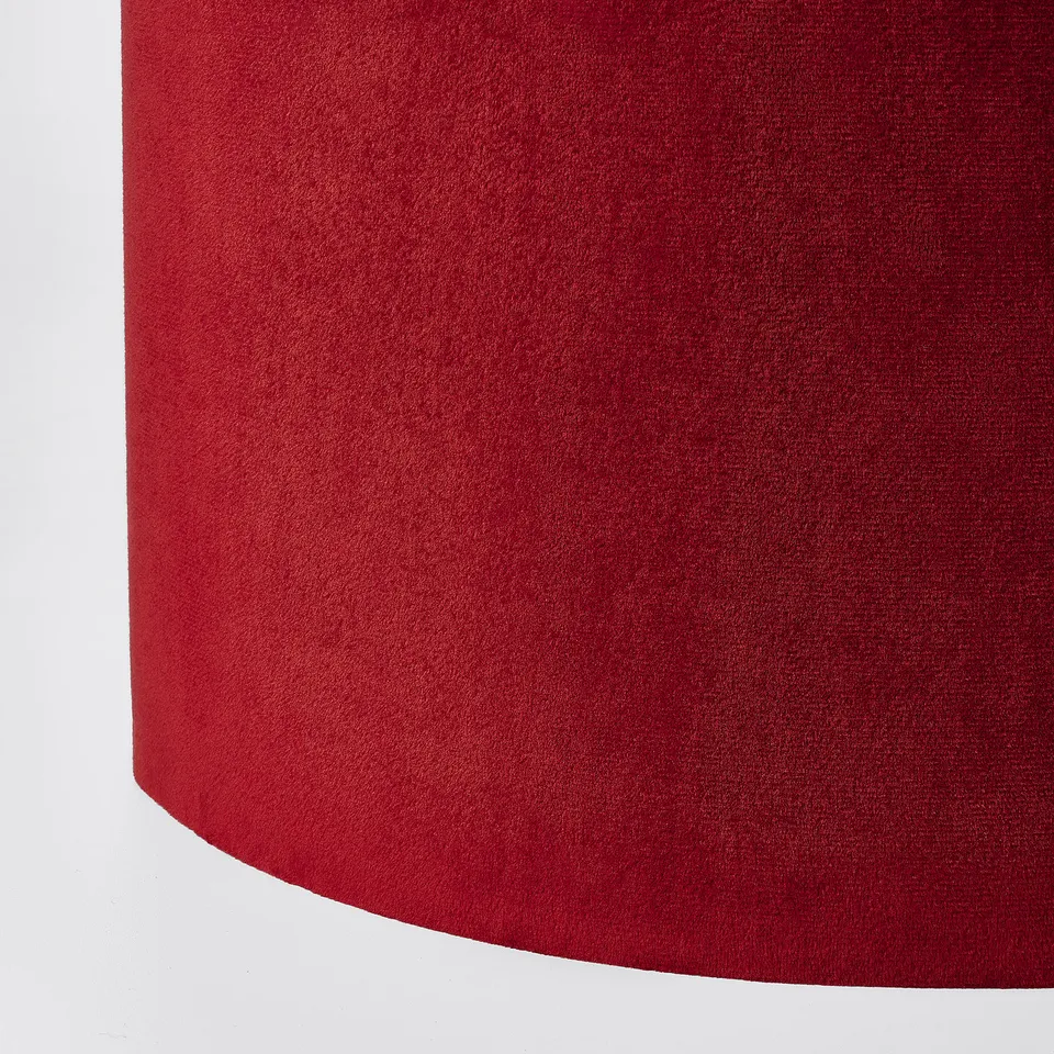 Close-up of red velvet lamp shade, smooth texture, luxury, soft, rich colour.