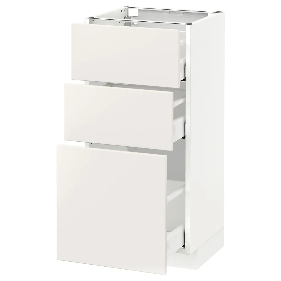 White METOD kitchen cabinet with three smooth drawers and sleek design.