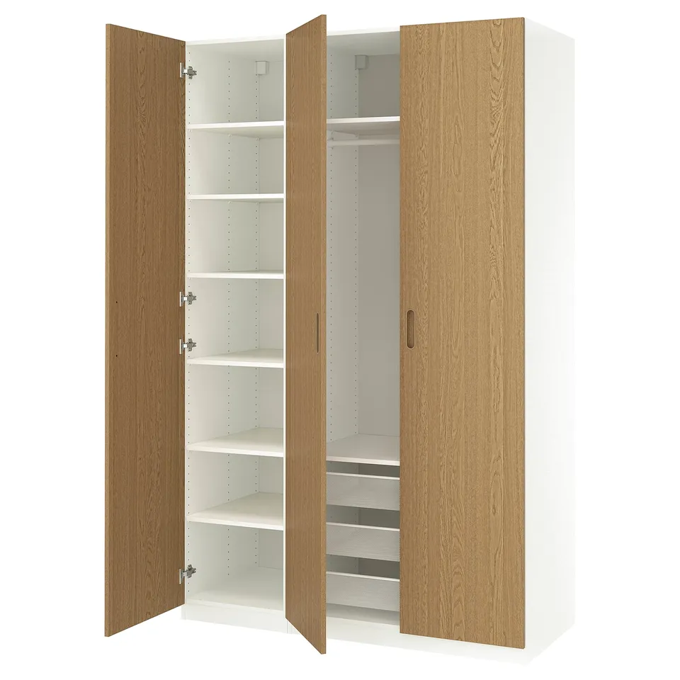Open wooden wardrobe with white interior, shelves, and drawers.