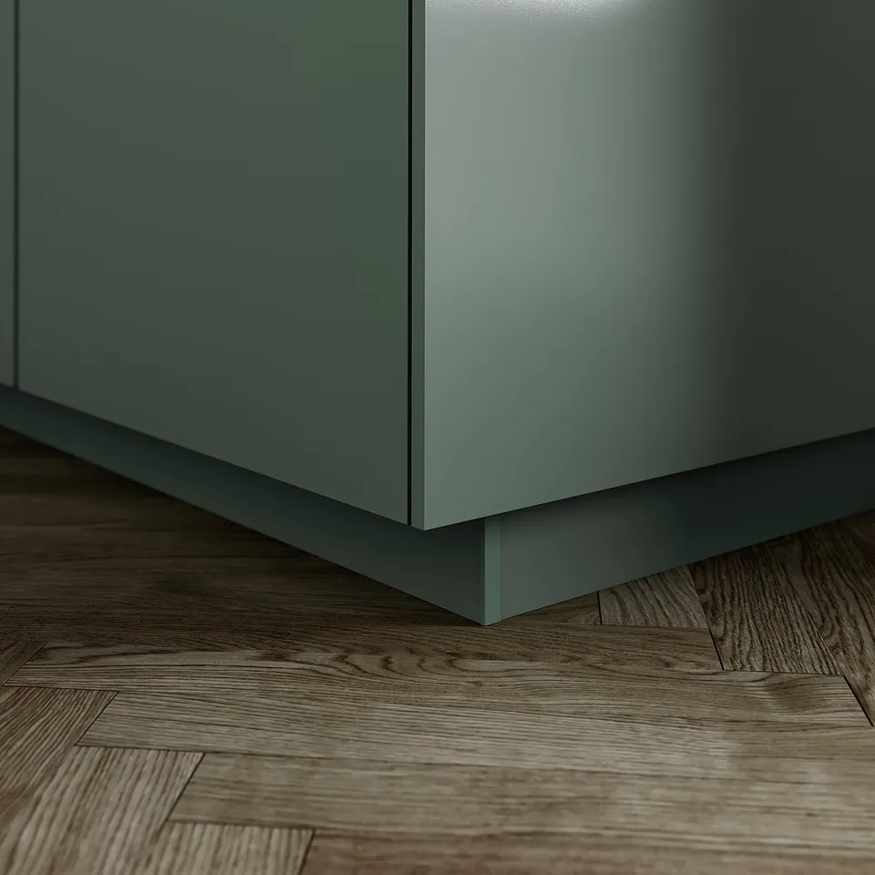 Close-up of modern grey-green kitchen cabinet base with stylish plinth, covering floor gap neatly, extending cabinets sleek design.