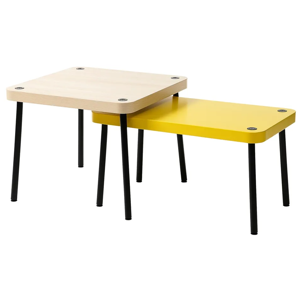 Two stackable tables, one yellow, one light wood, with black metal legs. Modern, minimalist design.