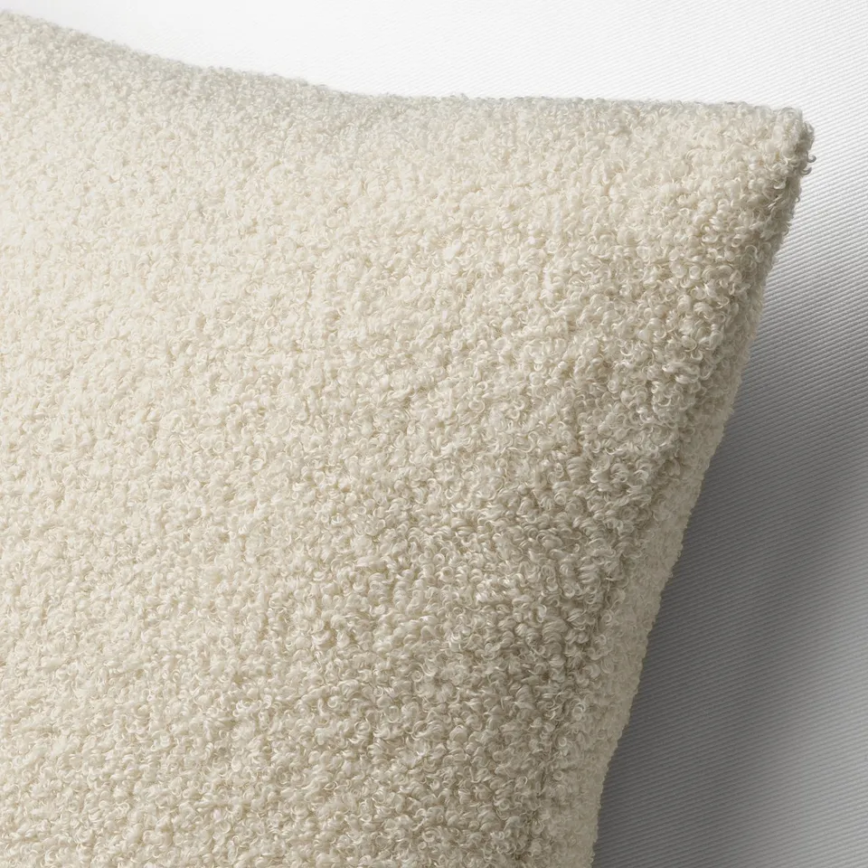 Soft beige cushion cover, teddy-like texture, high-quality, zippered, recycled polyester.