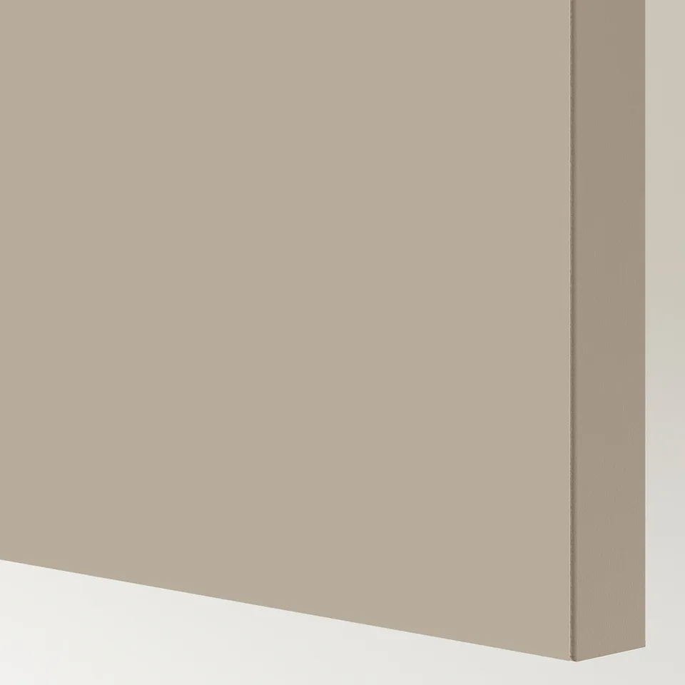 Close-up of a sleek, smooth, light beige sliding door with clean edges.