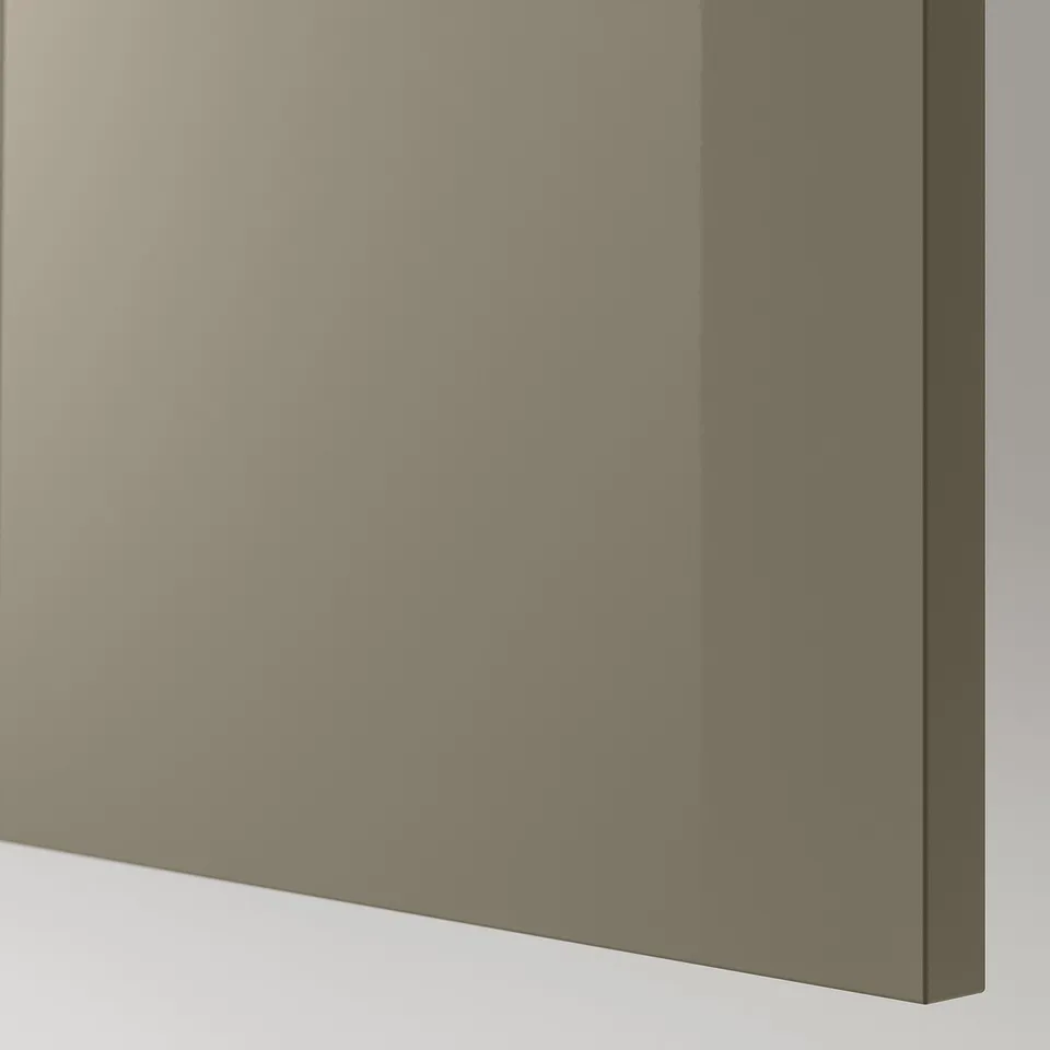 A close-up of a high-gloss, easy-clean particleboard panel with plastic edging, featuring a sleek finish.