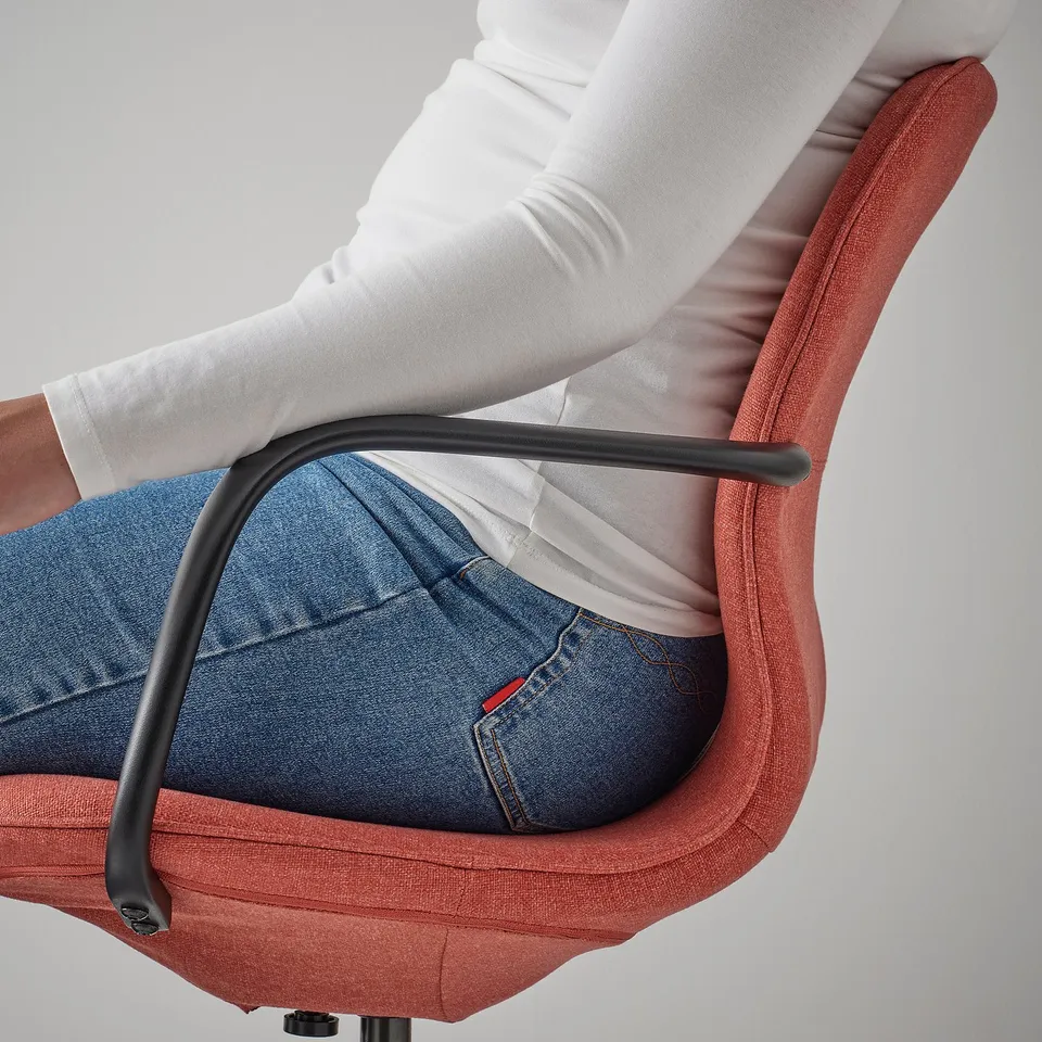 Red LÅNGFJÄLL office chair with weight-adjusted support.