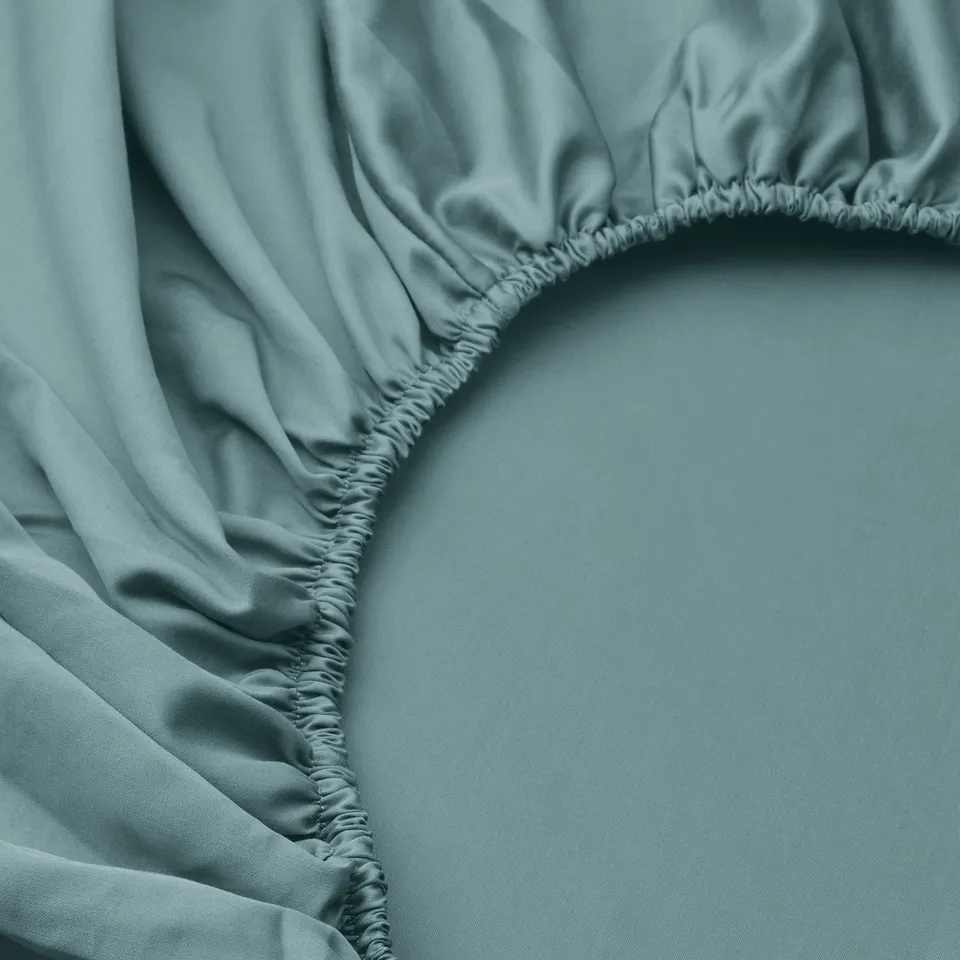 Blue-green fitted sheet with elastic edging.