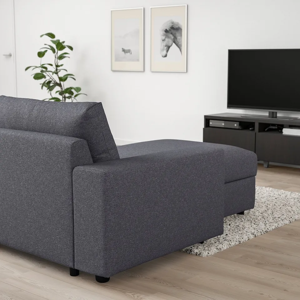 A grey VIMLE sectional sofa with chaise in a modern living room. Includes a convertible bed and durable gunnared fabric.