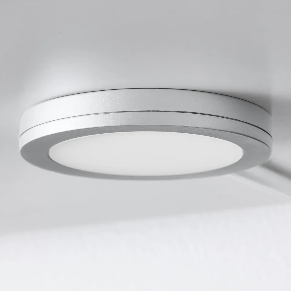 Round ceiling light, smooth white finish, modern design.