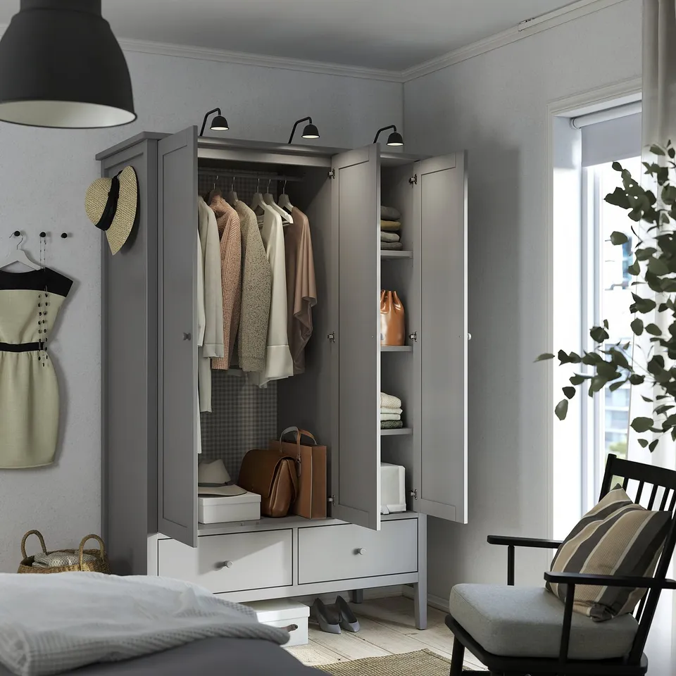 Elegant grey GULLABERG wardrobe with full-length mirror, clothes rail, and drawers for bedroom storage.