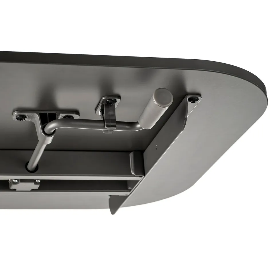 Close-up of sturdy sit/stand table mechanism with crank handle for smooth height adjustment.