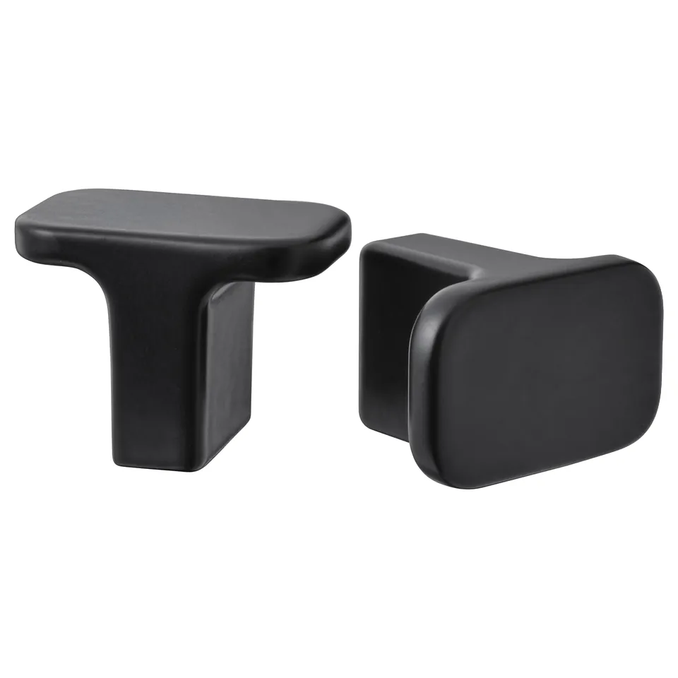 Black HACKÅS knobs, modern design, smooth and easy grip, aluminium material.