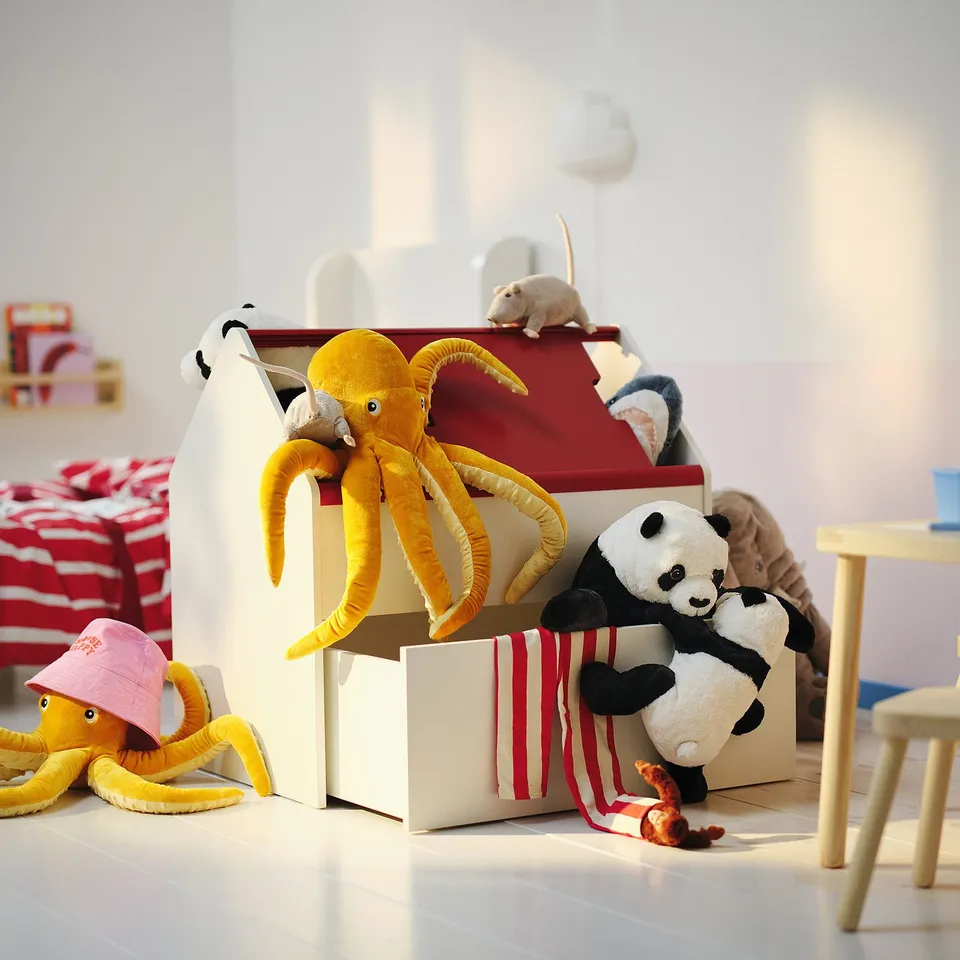 Kids storage box in beige, white, and red. Holds plush toys, ideal for organising.