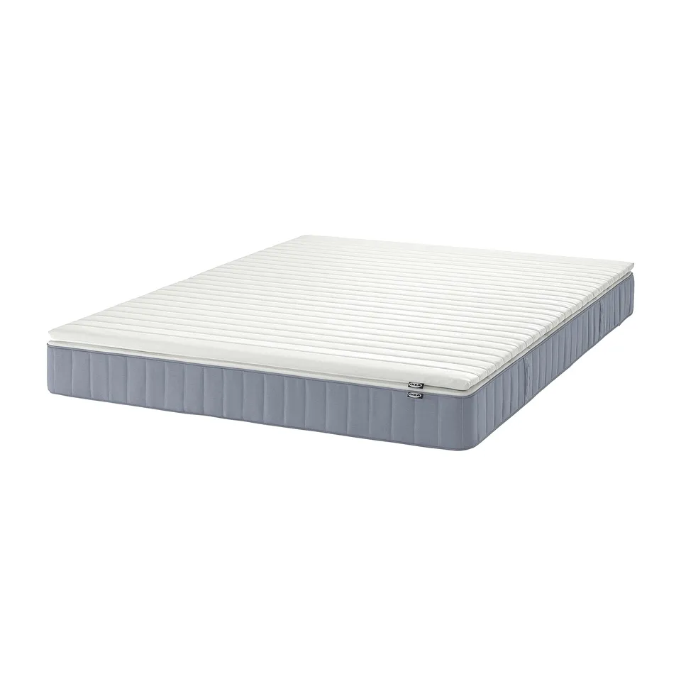 A VESTERÖY pocket spring mattress in white and light blue, rectangular, with a textured surface.
