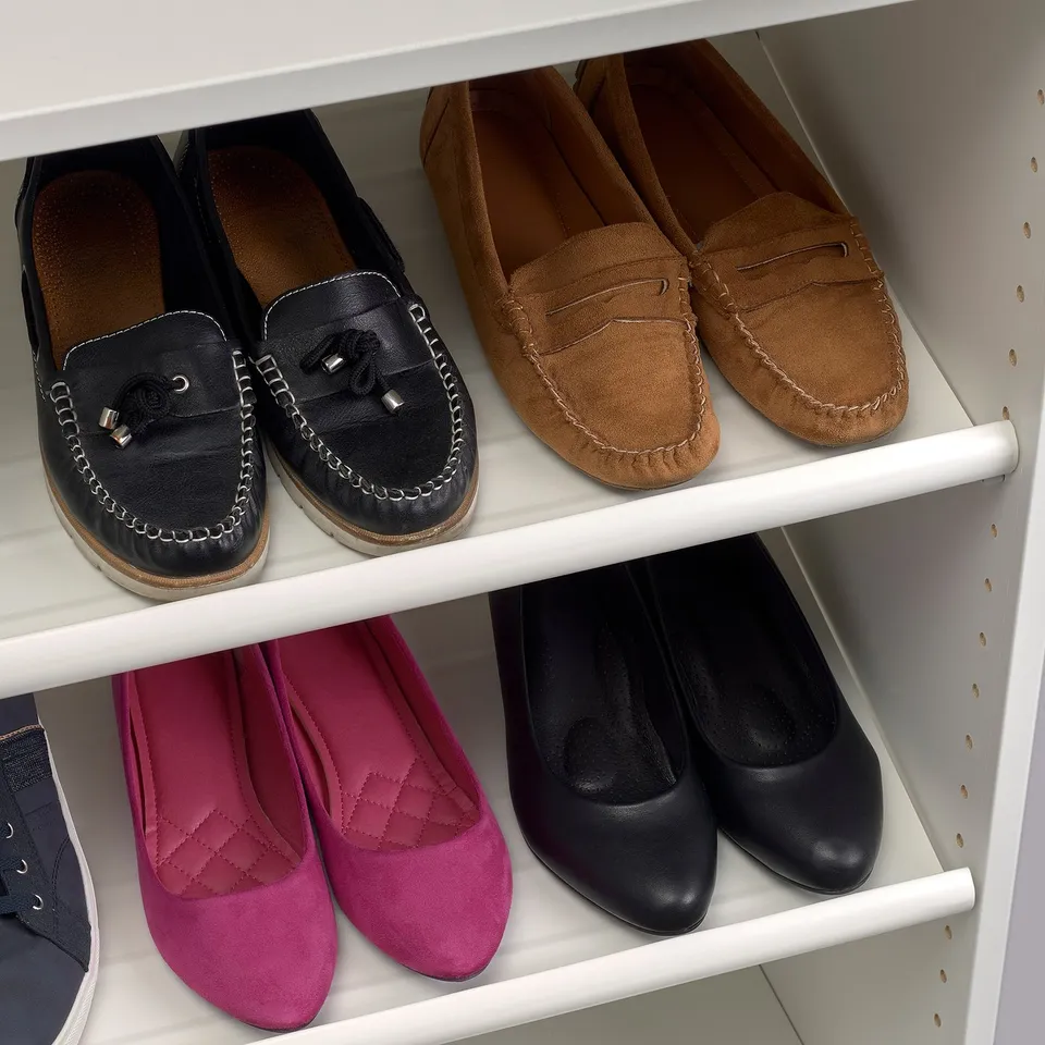 Shoe shelf with loafers, heels, pink shoes, sturdy.